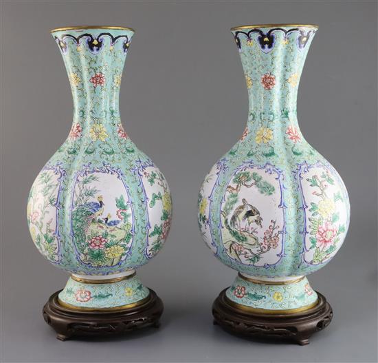 A pair of Chinese Canton enamel vases, early 20th century, H. 35cm, wood stands